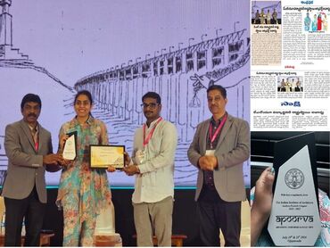 Two men in bicycle jerseys sitting outside at table having coffee
