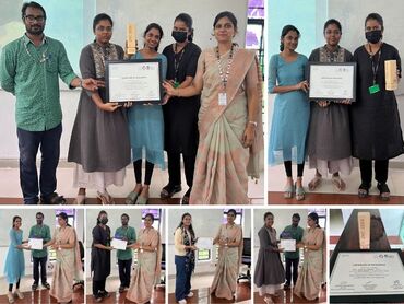 Two men in bicycle jerseys sitting outside at table having coffee