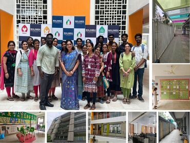 Two men in bicycle jerseys sitting outside at table having coffee