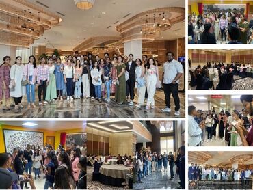 Two men in bicycle jerseys sitting outside at table having coffee