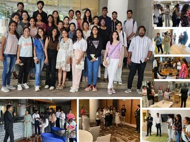 Two men in bicycle jerseys sitting outside at table having coffee
