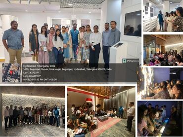 Two men in bicycle jerseys sitting outside at table having coffee