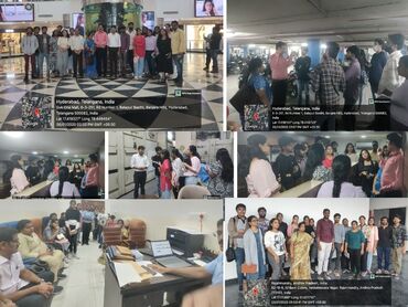 Two men in bicycle jerseys sitting outside at table having coffee